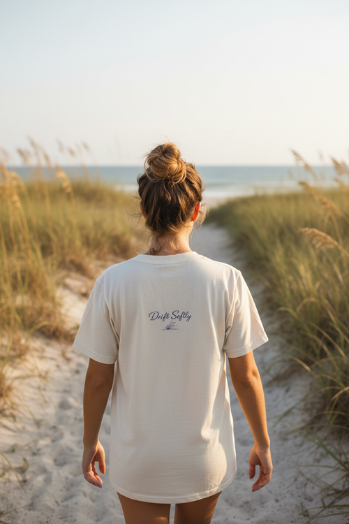 Drift Softly Tee back graphic - walking beach path through sea oats
